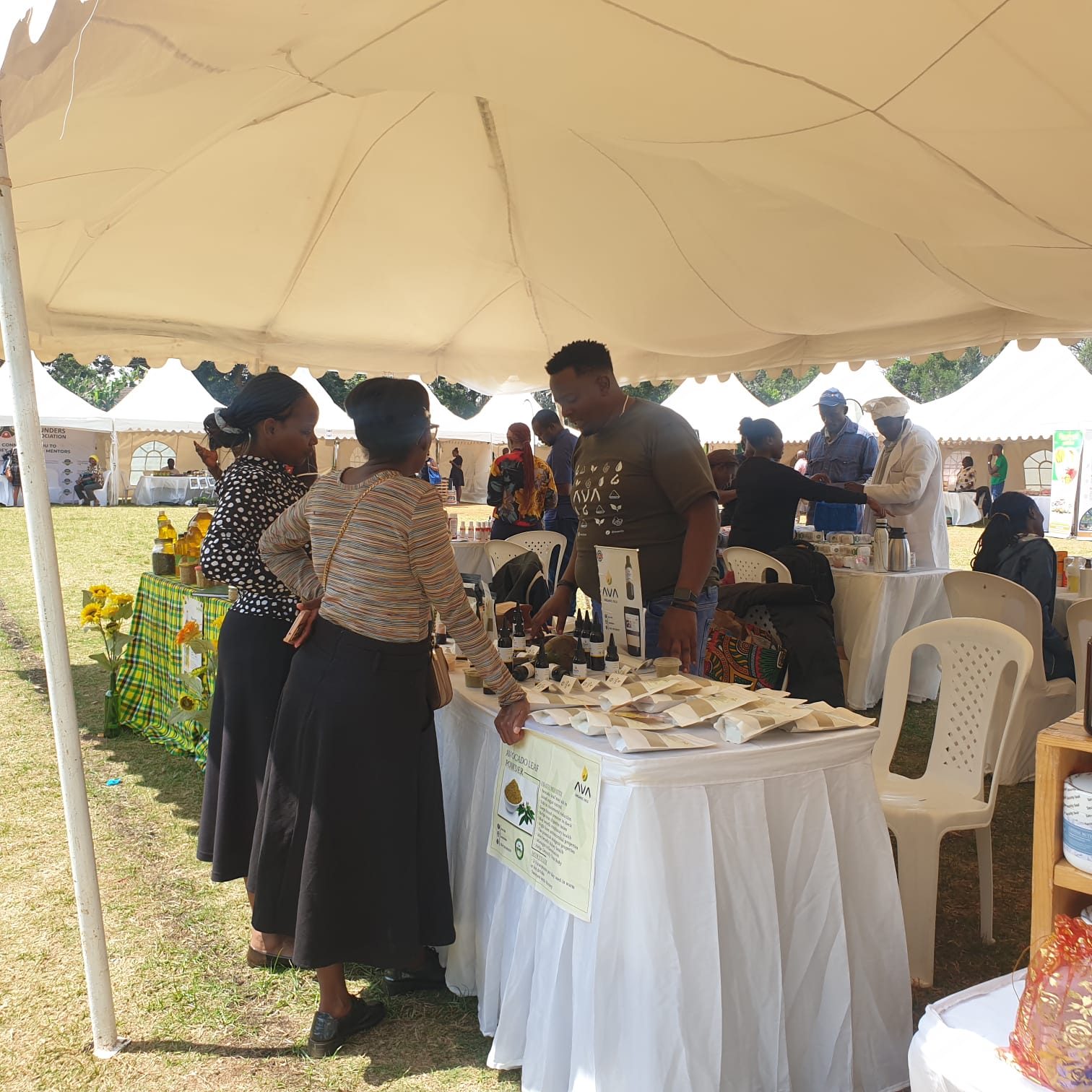 Exhibitor showcasing products at a booth